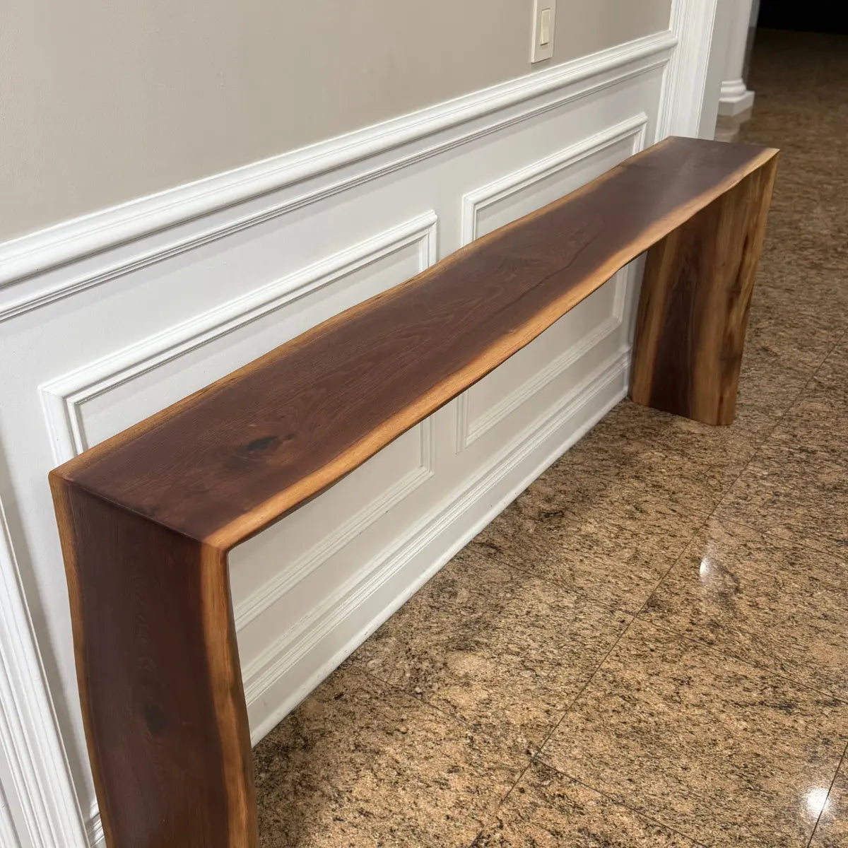 Black walnut console Table against wall full shot
