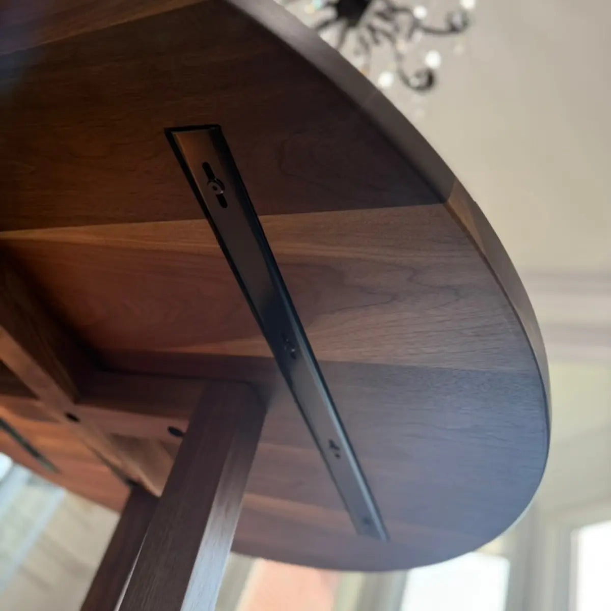 close up walnut table metal c channel