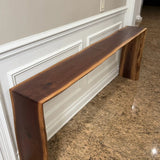 Black walnut console Table against wall full shot